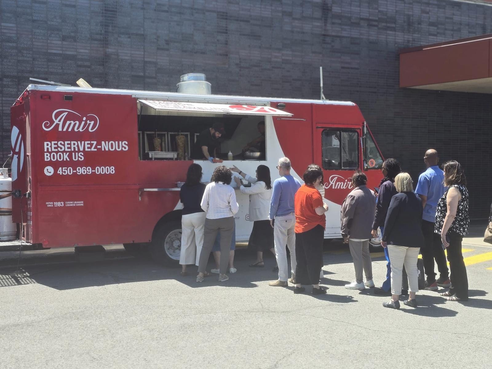 Amir food truck with guests at a corporate event