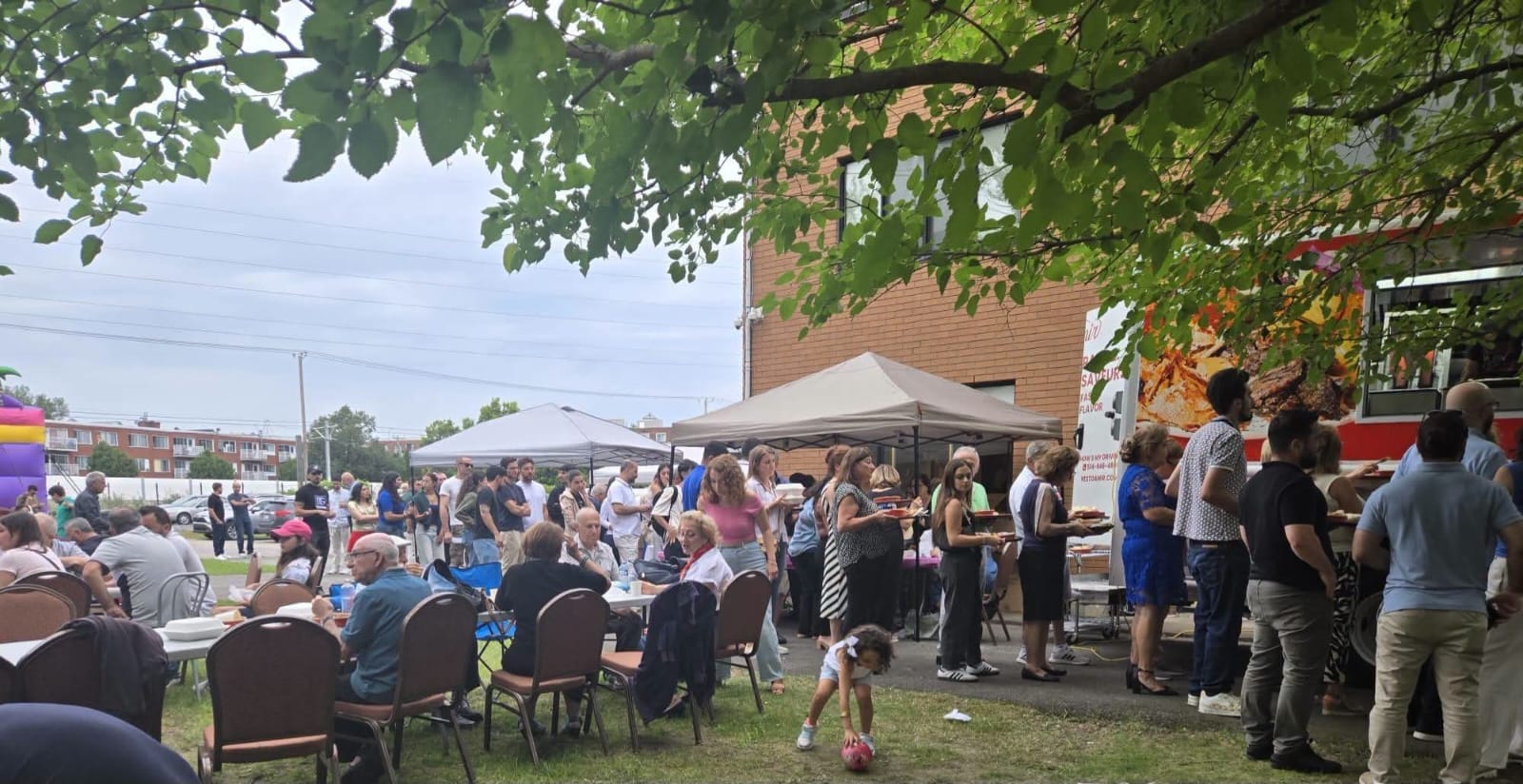 Amir Express serving guests at an outdoor community event