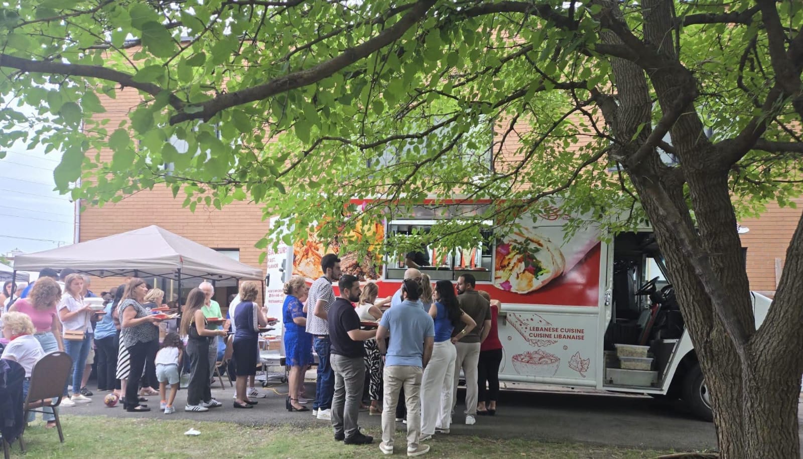 Amir Express food truck serving a busy outdoor event